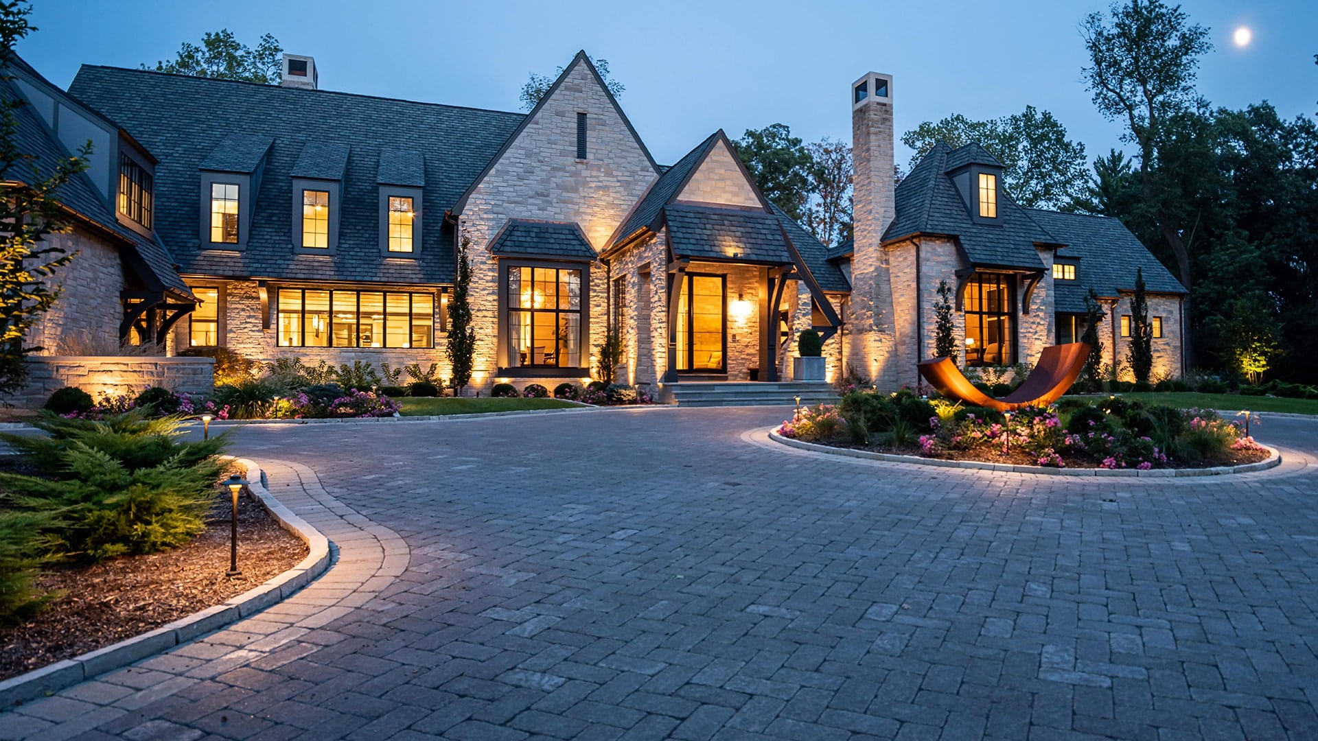 Huntleigh home with outdoor lighting